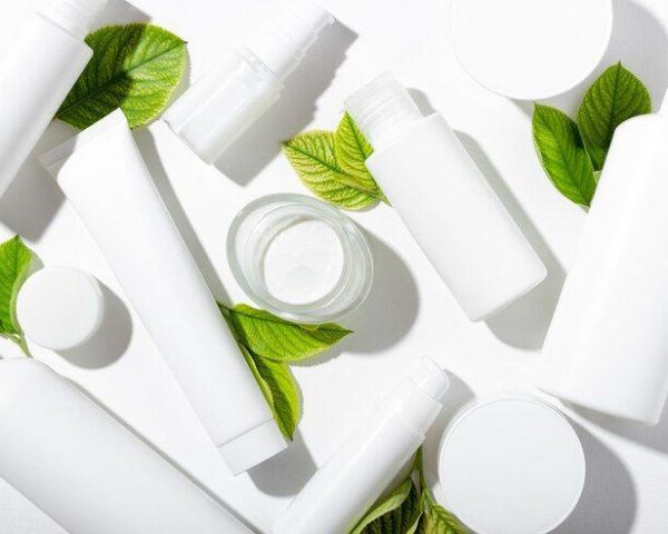 set-cosmetic-products-white-tubes-with-green-leaves-with-empty-space-labeling-natural-cosmetics-face-body-skin-care-moisturizing-cream-purifying-mask_73253-1441